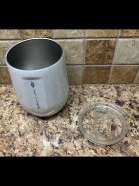 White Corkcicle Stemless Tumbler with Sliding, shatter-proof lid.